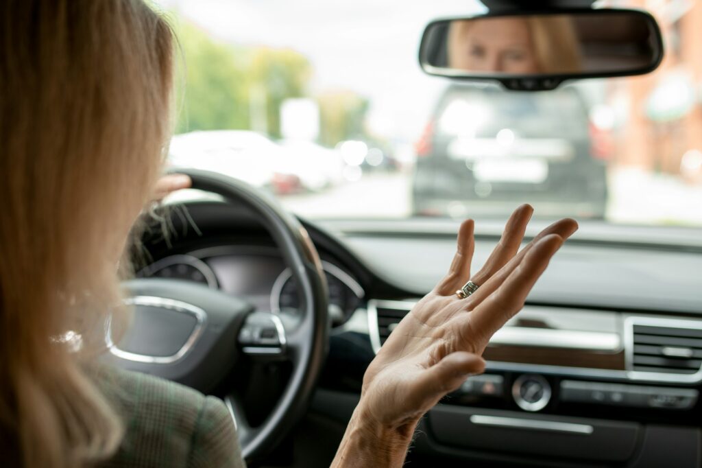 Hand of irritated and tired mature blond businesswoman expressing annoyance